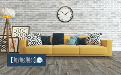 Invincible H2O flooring in living room with yellow sofa